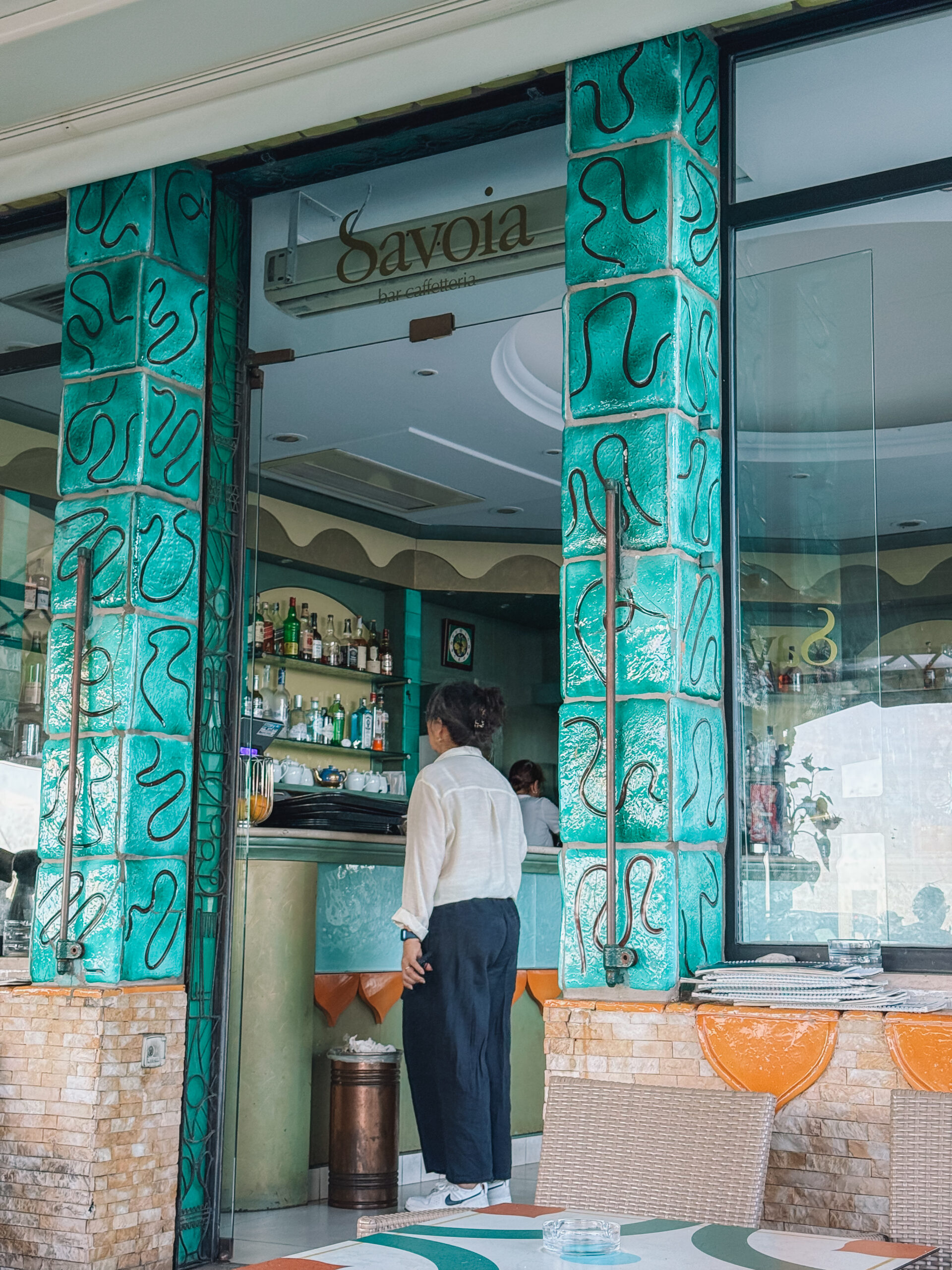 Colorful cafe entrance in Amalfi with turquoise tiles and Italian coastal decor