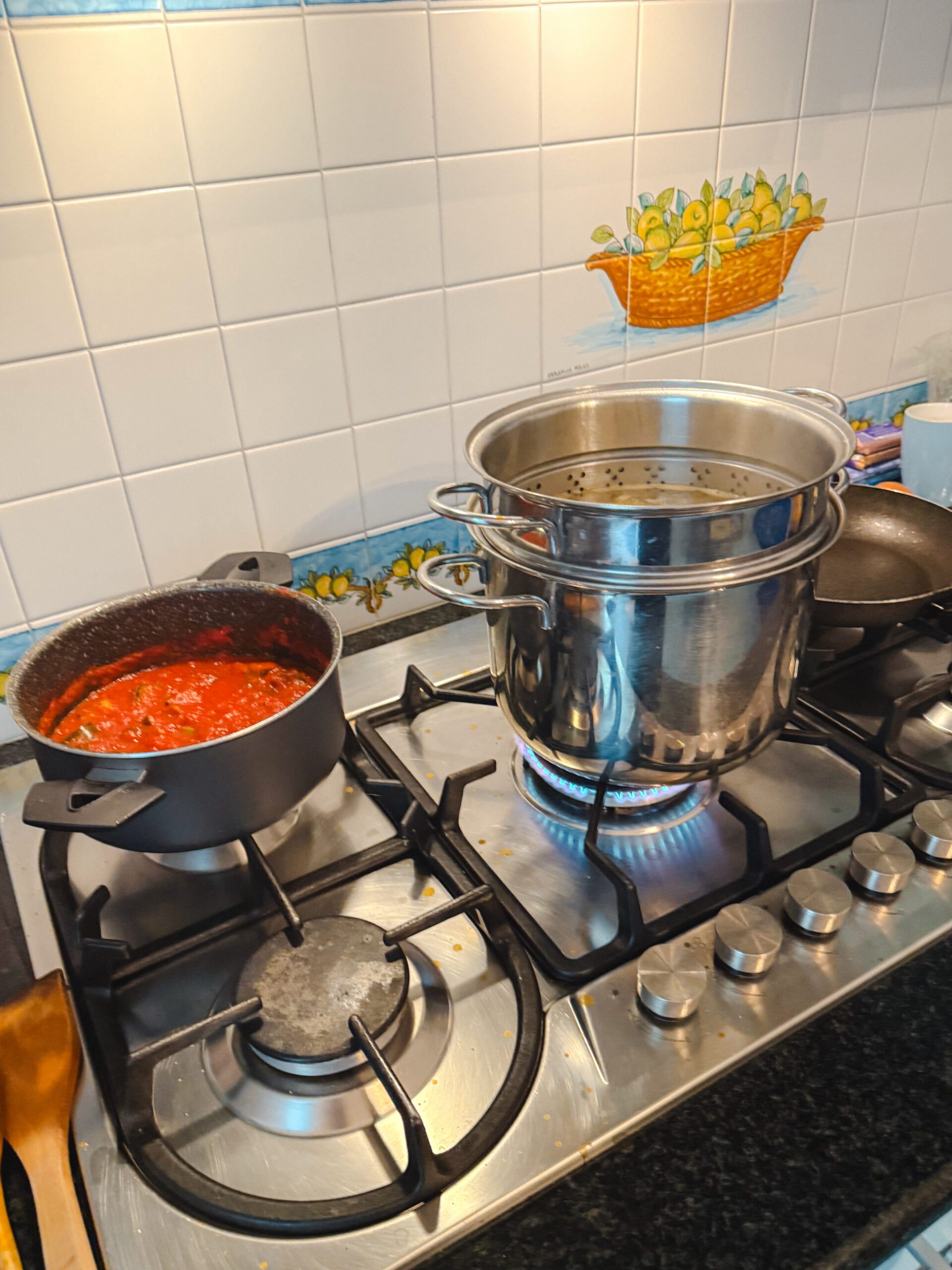 Fresh tomato sauce and pasta cooking in an Italian kitchen on the Amalfi Coast