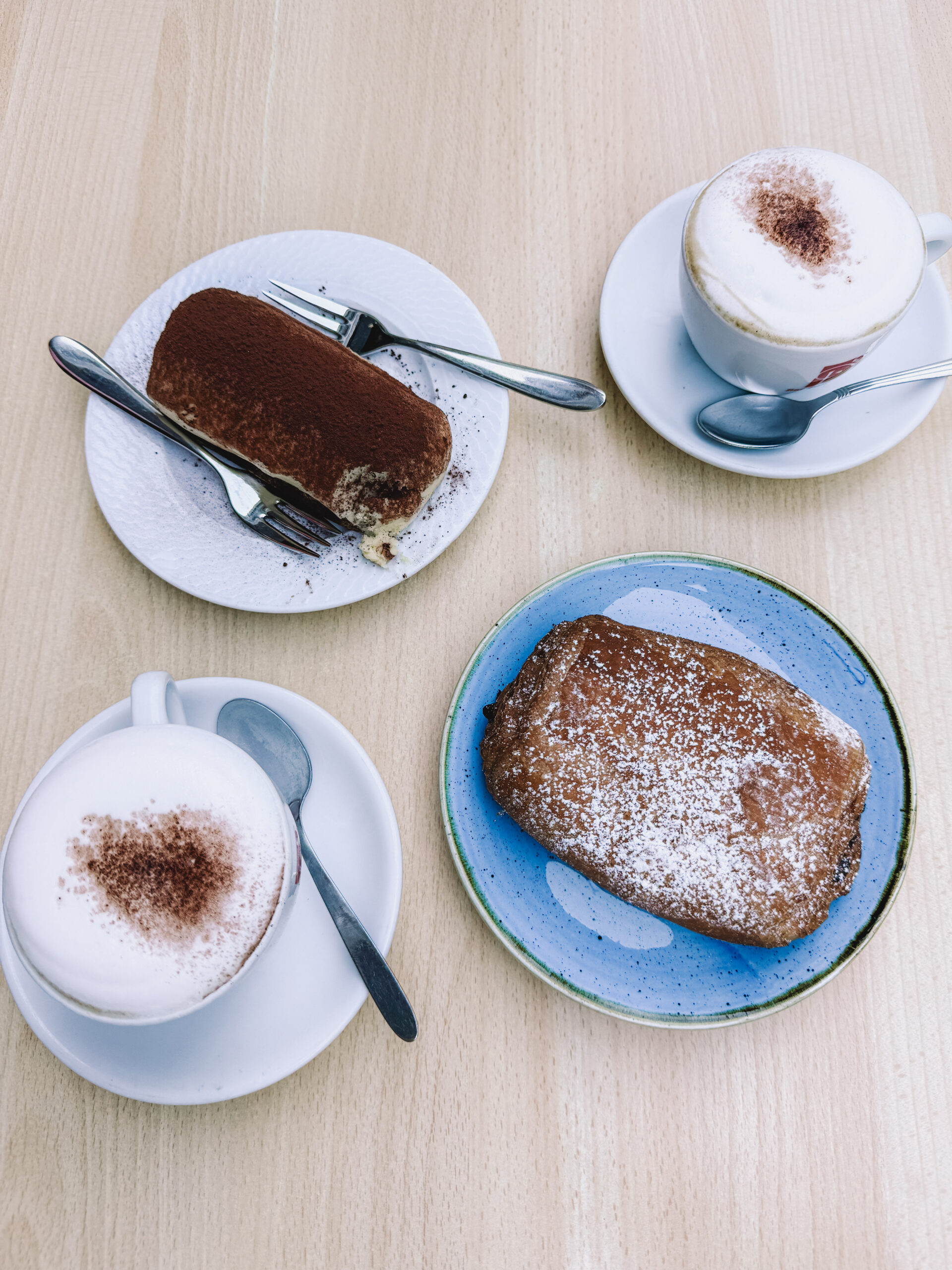 Traditional Italian tiramisu and cappuccinos at a local café in Amalfi, Italy before an Amalfi Coast lemon farm tour.